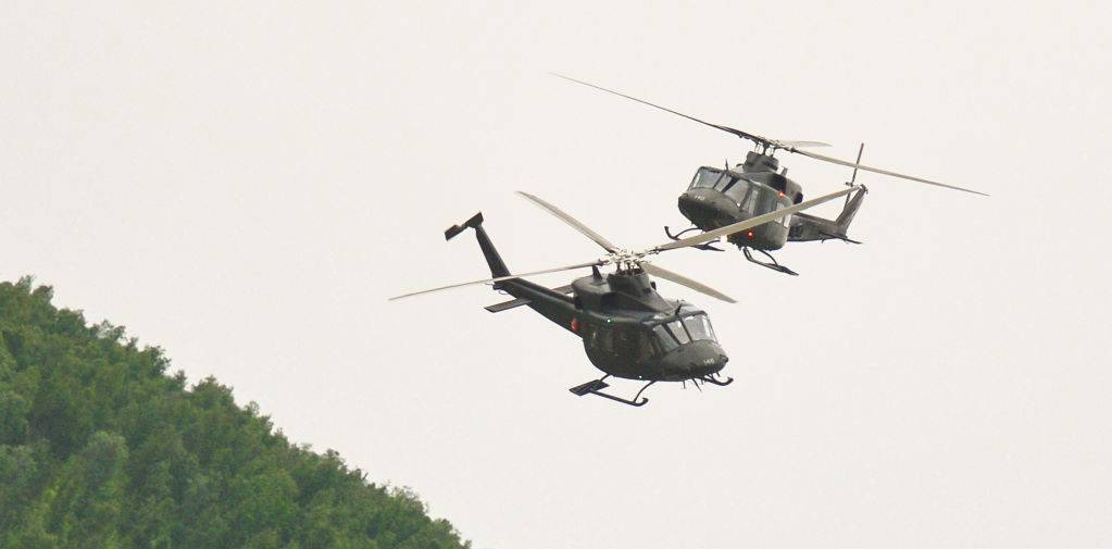 Two Norwegian Army helicopters fly close over Bardufoss Airport, Norway. Photo: Getty Images