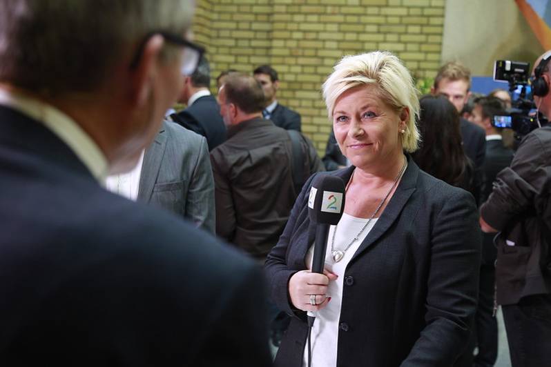 The leader of the Progress Party (FrP), Siv Jensen, speaking to media in the Norwegian parliament after the coalition government the party belonged to had presented their annual budget plans on Oct. 14, 2014. Terje Heiestad