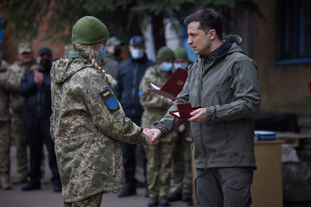 Ukrainian female sergeant being awarded an order. President of Ukraine's office