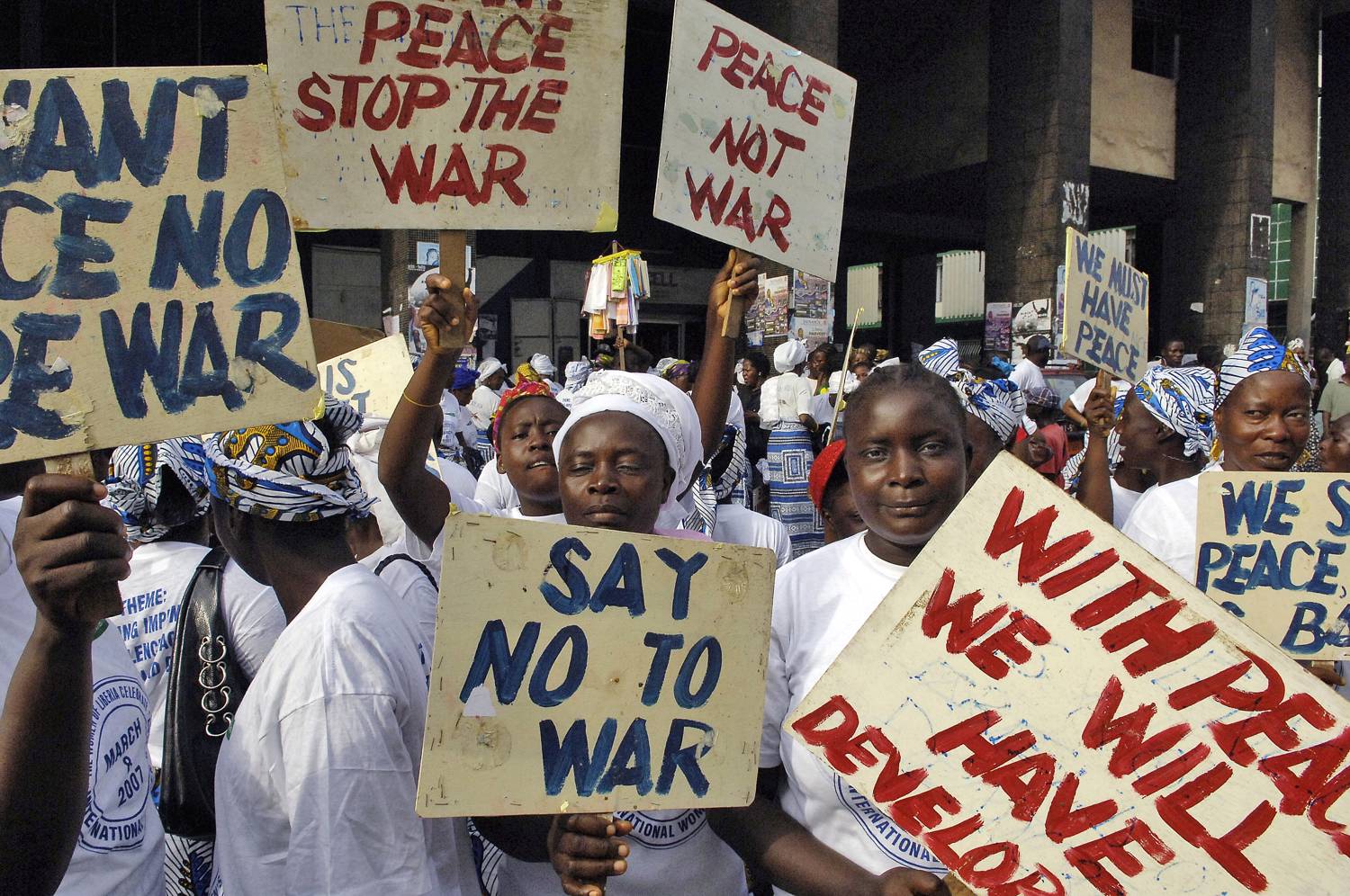 Liberian women demonstrate at the American Embassy in Monrovia at the height of the civil war, 2003. UNMIL