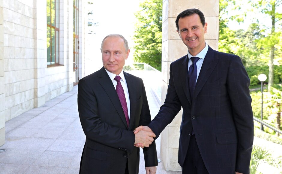 Vladimir Putin meets  Bashar Al-Assad in Sochi in 2018. Photo: Kremlin Press Office / Handout/Anadolu Agency/Getty Images