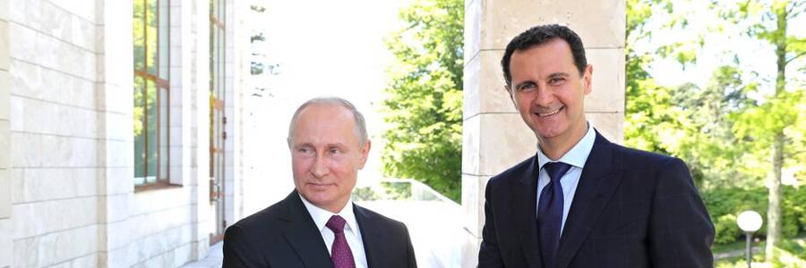 Vladimir Putin meets  Bashar Al-Assad in Sochi in 2018. Photo: Kremlin Press Office / Handout/Anadolu Agency/Getty Images