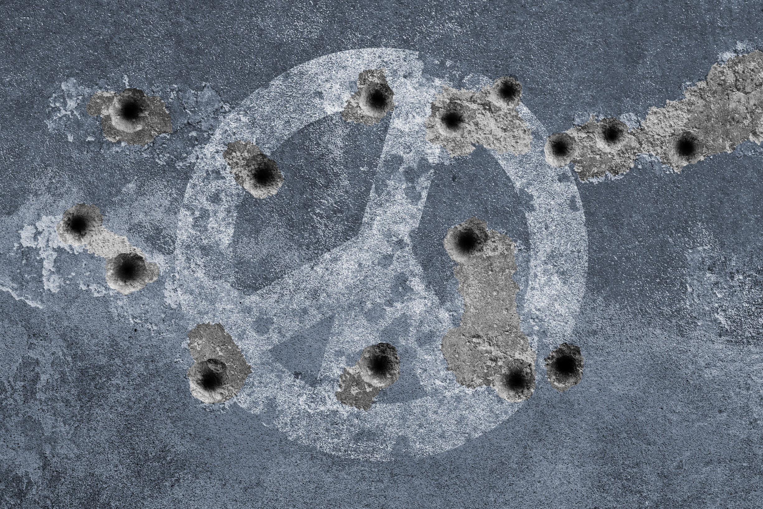 Peace symbol on a wall with bullet holes. Photo: Getty Images