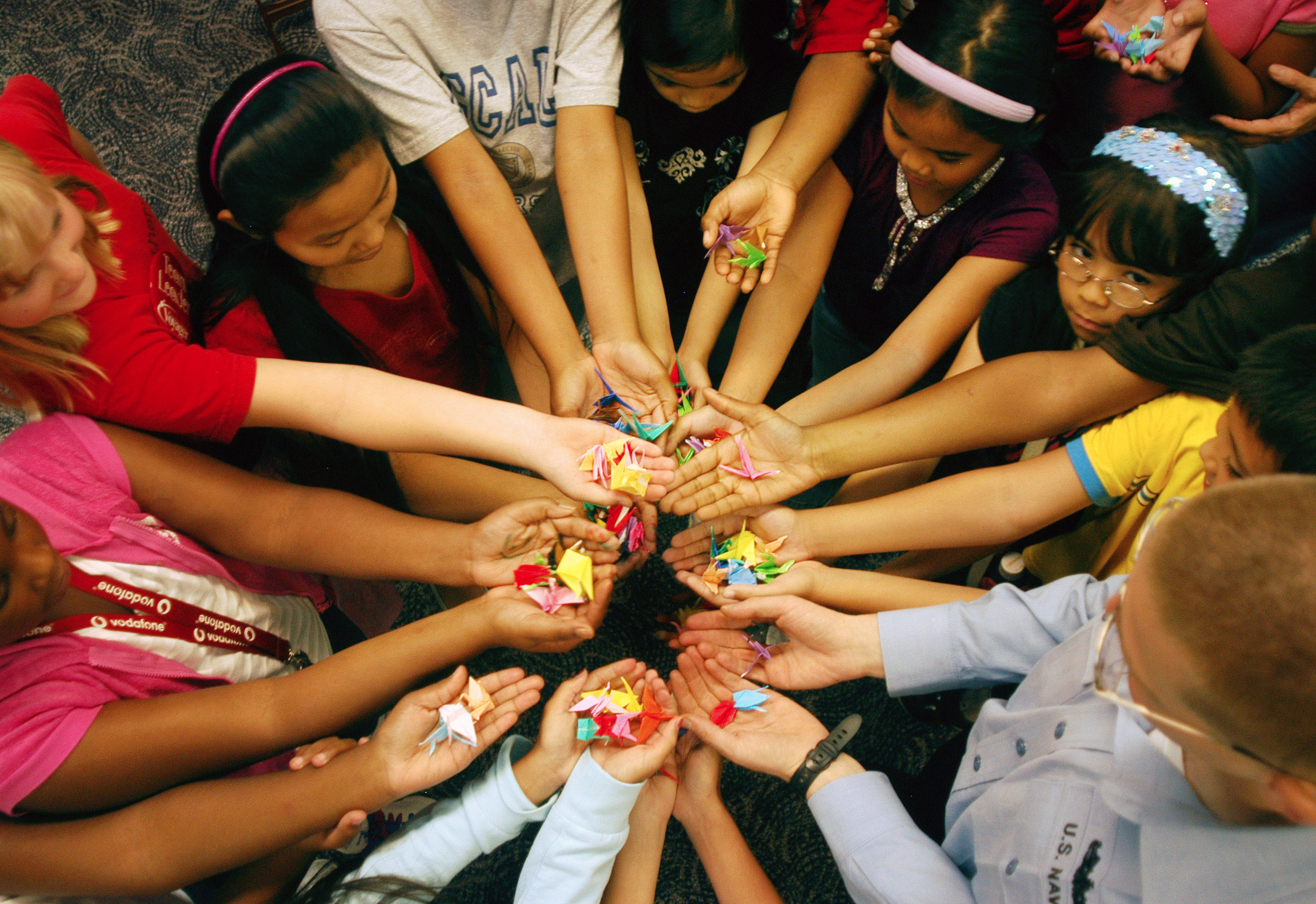 070718-N-0807W-049
SASEBO, Japan (July 18, 2007) - Students from Jack N. Darby Elementary School learn and construct Japanese origami cranes from a U.S. Navy Sailor as a symbolic gesture toward peace in Sasebo, Japan. The cranes are part of a larger effort to make 1,000 cranes, which Japanese culture has defined as a milestone number in expressing sentiments of peace and good fortune. The cranes will be delivered later this month to the Nagasaki Peace Park. U.S. Navy photo by Mass Communication Specialist 2nd Class Joshua J. Wahl (RELEASED). Photo: MC2 Joshua J. Wahl