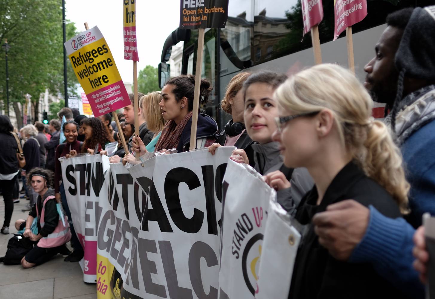 Participators in and supporters of the Calais 'Jungle' Refugee Camp aid convoy assembling in Whitehall, London.