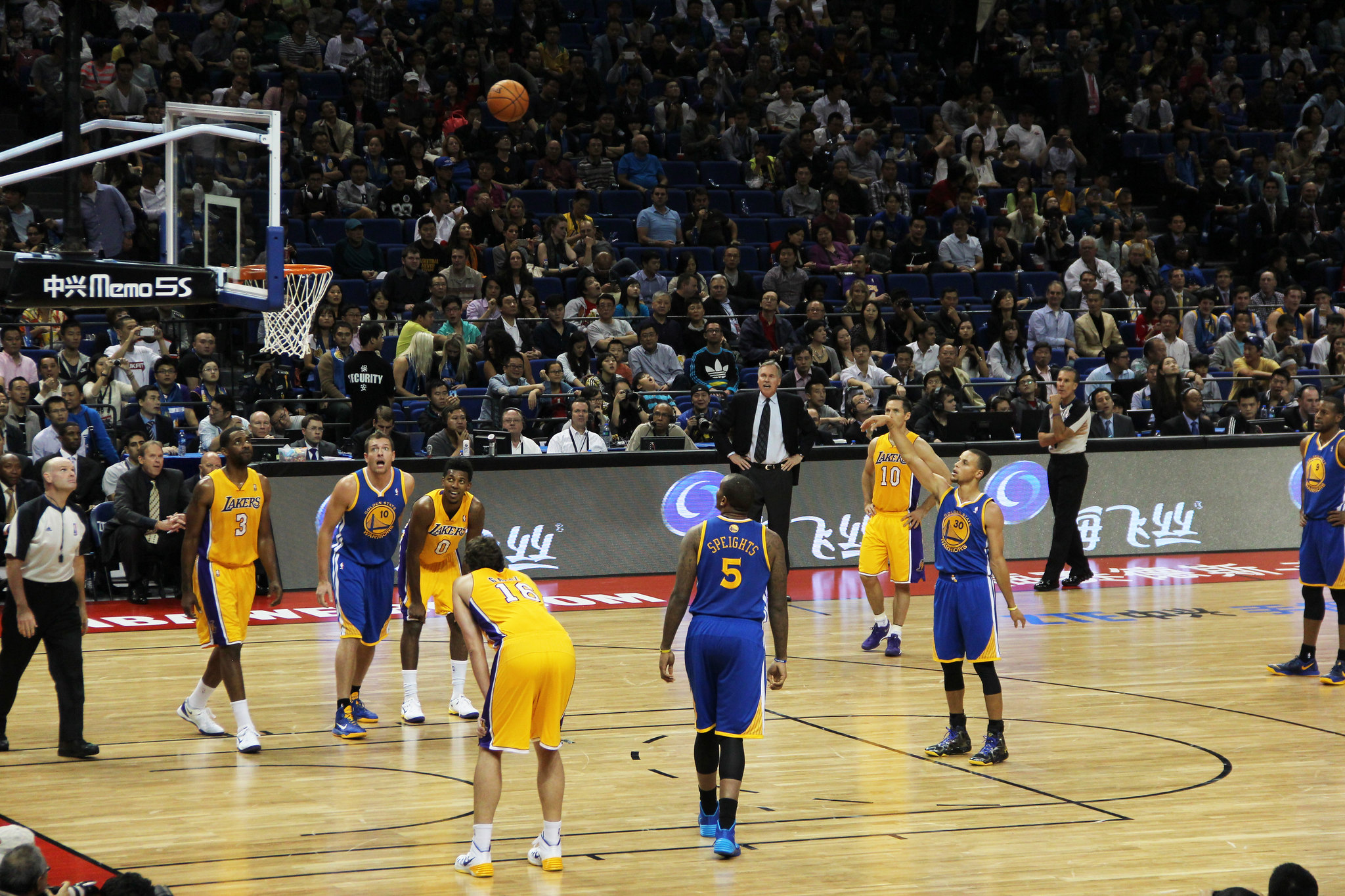 The Lakers play the Golden State Warriors in a 2013 NBA Global Games match in China. kpang21 CC via Flickr.