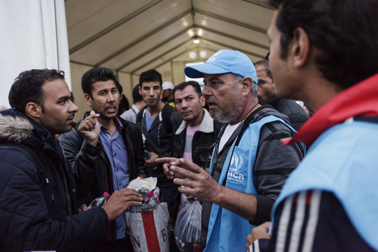 Refugees and migrants waiting at the Idomeni transit station in Greece. Photo: UNHCR/ Achilleas Zavallis