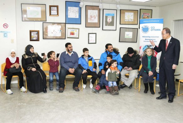 Secretary-General Ban Ki-moon (right) visits the Catholic Centre for Immigrants in Ottawa, Canada, where he met with families who have arrived from Syria and the region and who are now part of Canada’s resettlement programme. Photo: UN/Evan Schneider