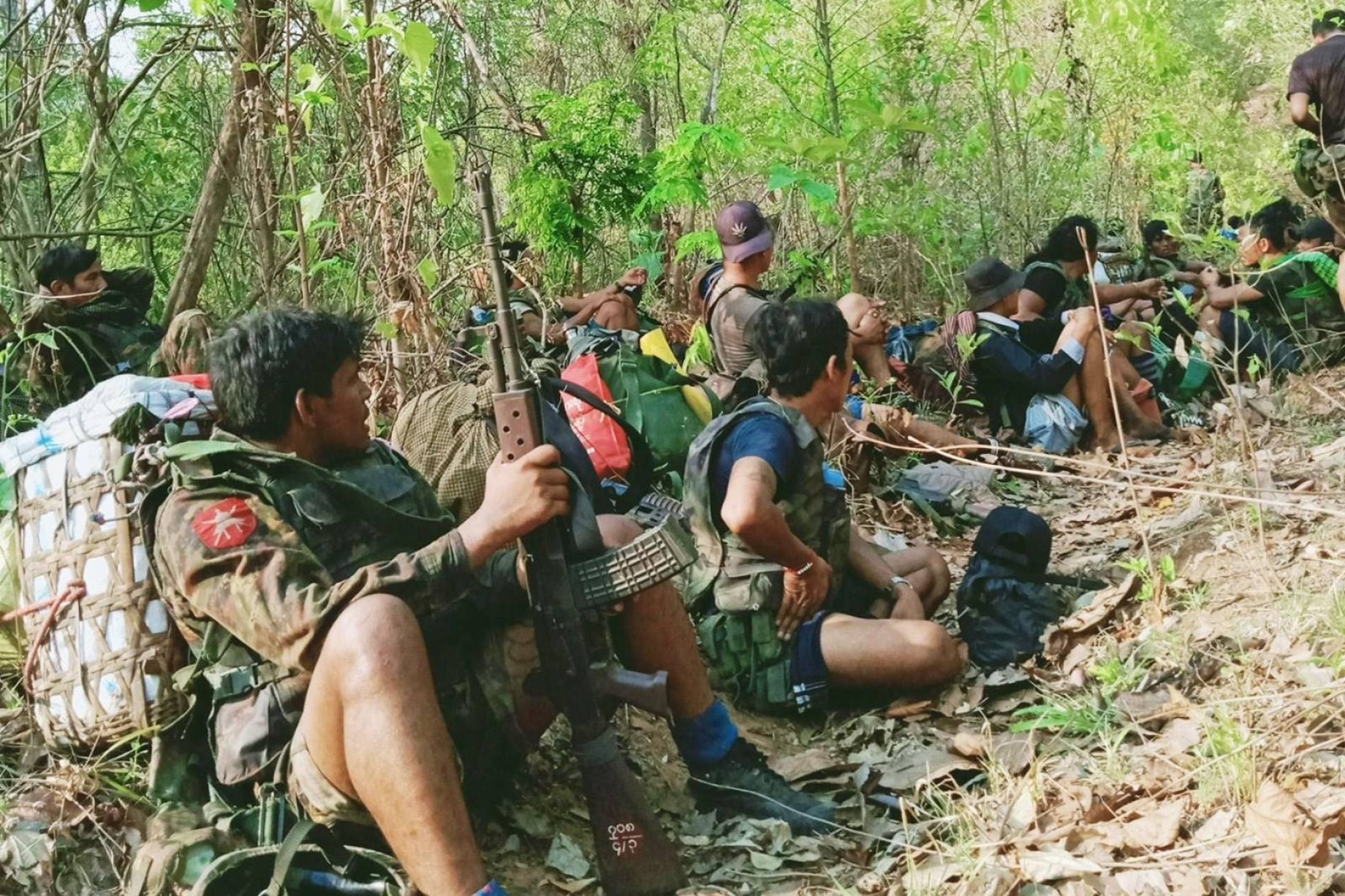 A photo taken by a regime soldier shows junta troops and Pyu Saw Htee members resting during operations in Sagaing Region in 2022. Source: Myanmark Now.