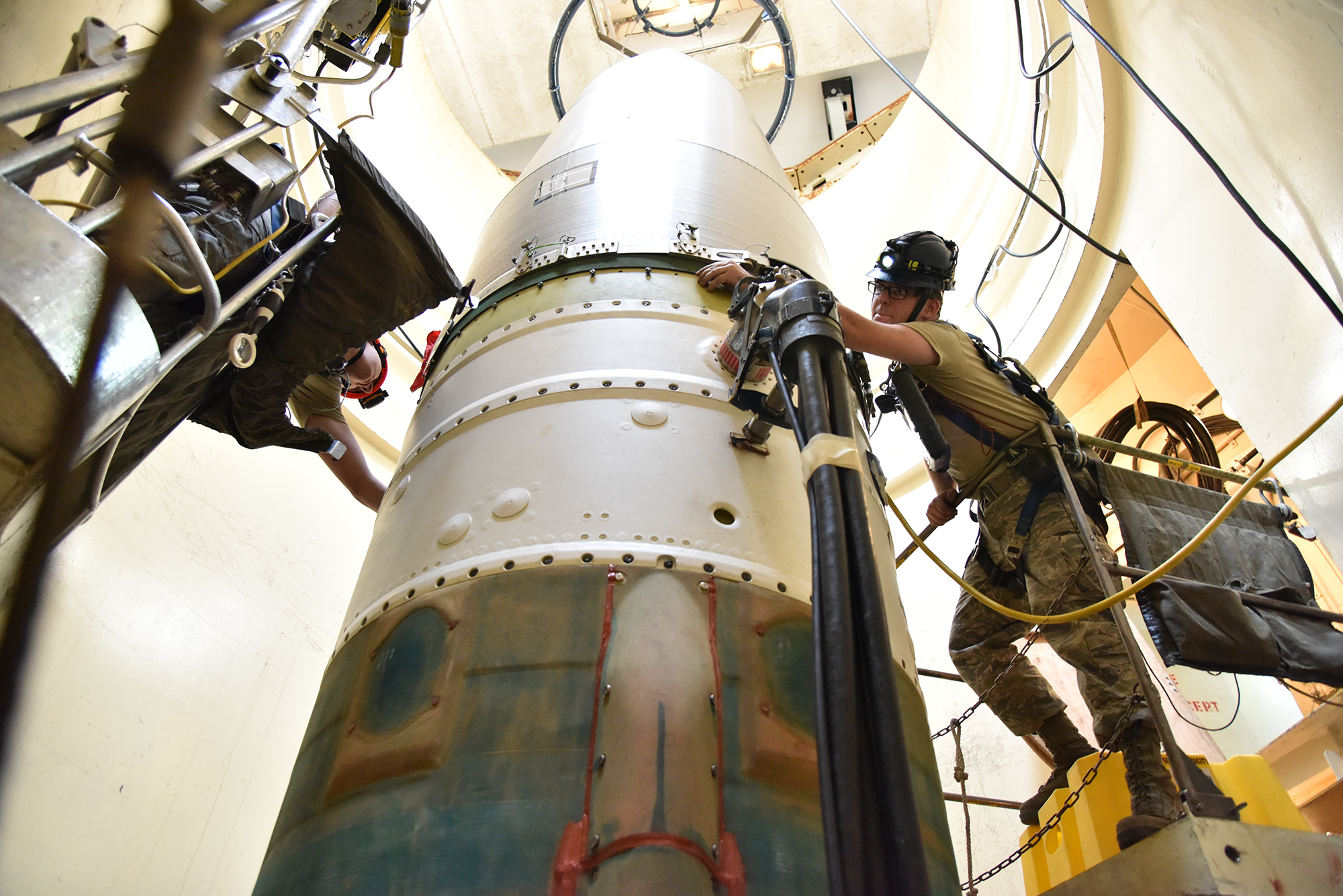 US military personell maintaining an intercontinental ballistic missile. Photo: Senior Airman Daniel Brosam