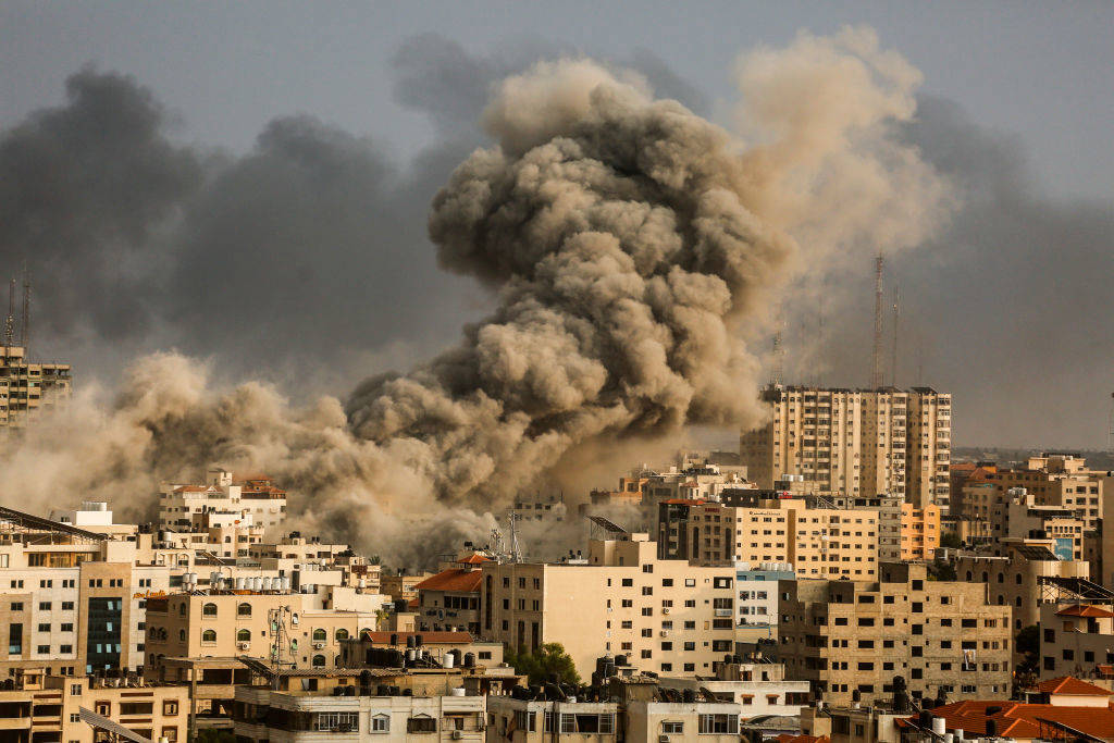 A smoke rises over a buildings in Gaza City on October 9, 2023 during an Israeli air strike. Photo: Sameh Rahmi/NurPhoto via Getty Images