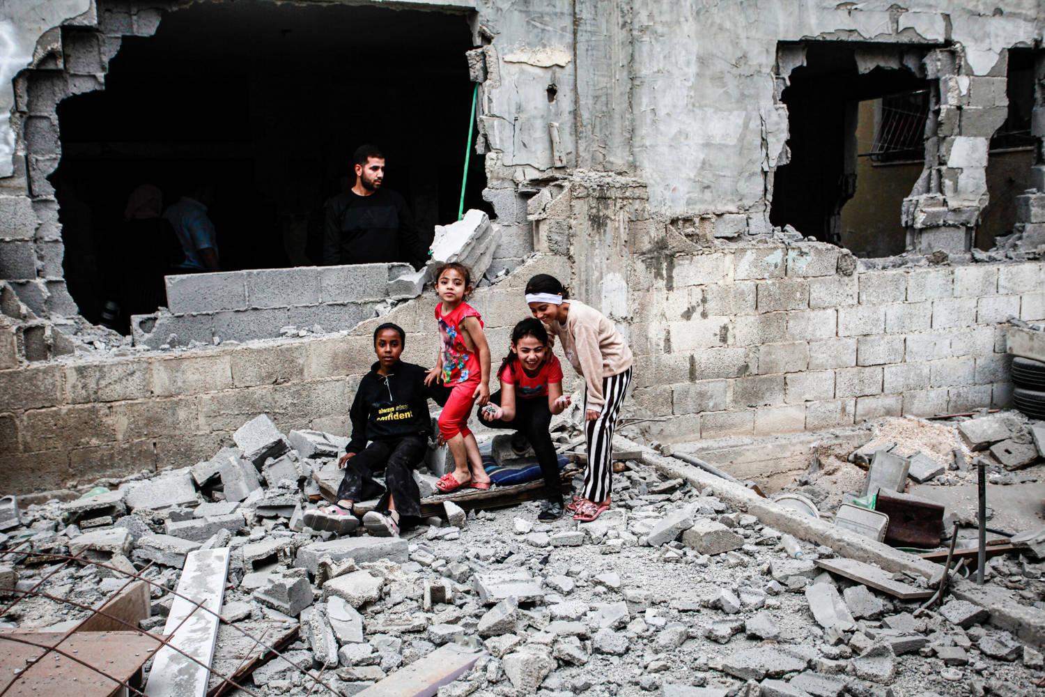 Palestinian children playing inside a destroyed house in the Askar refugee camp, October 2023. Photo: © 2023 SOPA Images via Getty Images