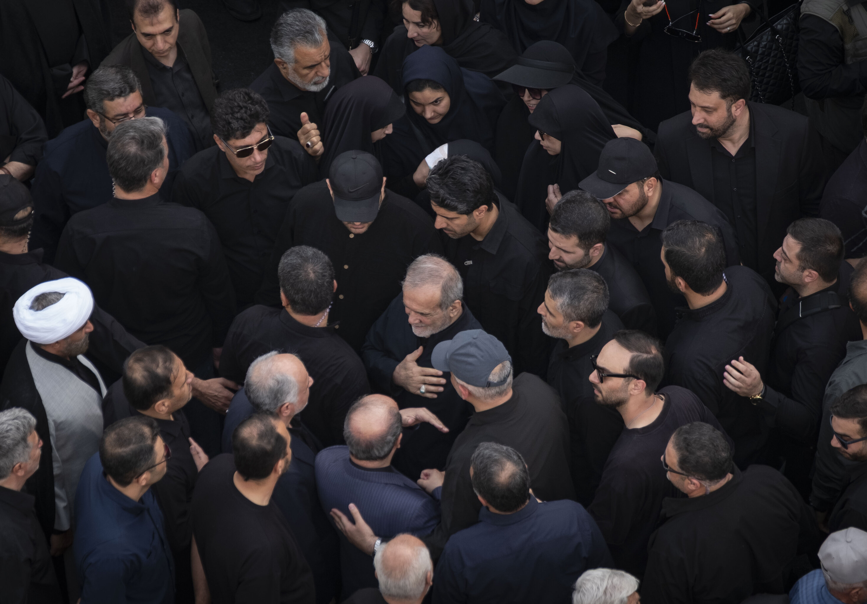 Iranian President, Masoud Pezeshkian, attending a funeral for those killed in Israeli attacks in June. Photo: Morteza Nikoubazl/NurPhoto via Getty Images