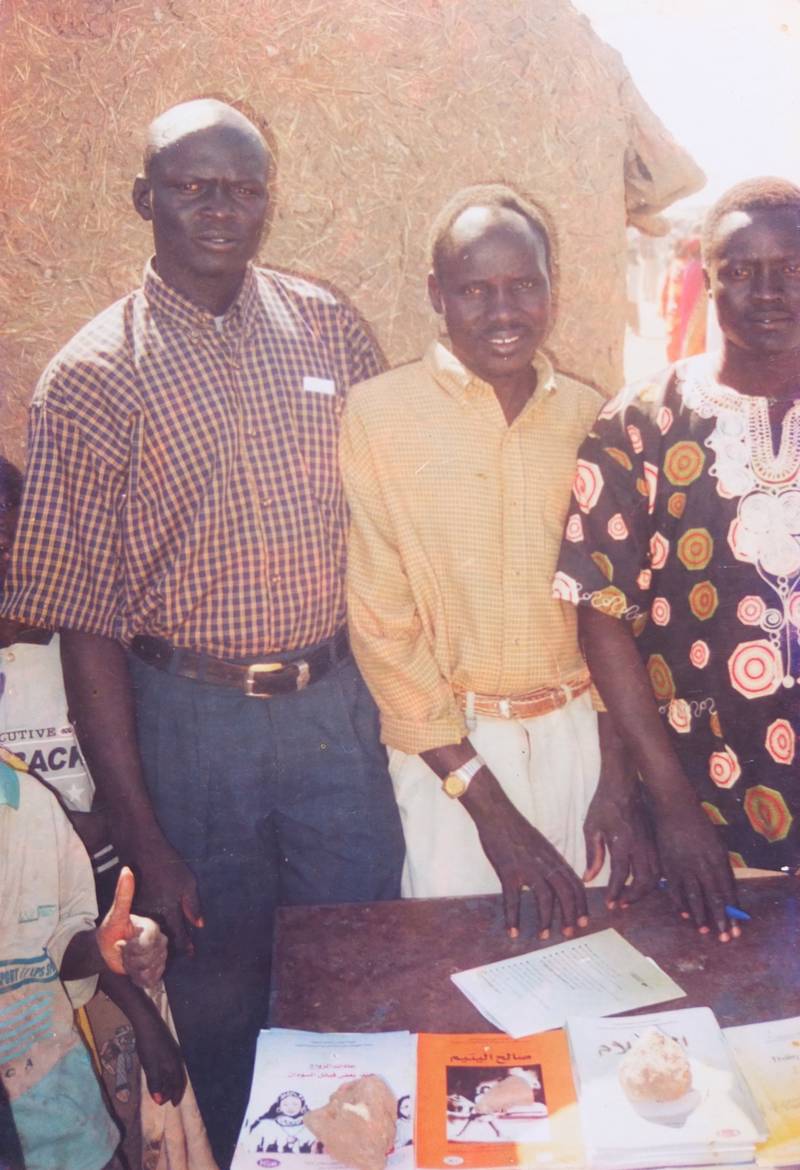 Local residents and self-published authors selling their pamphlet histories and story-books on the street in the displaced settlement of Jabarona, Khartoum. Photo: Angelina and Josephine, Ariath / Apada, South Sudan, used with permission