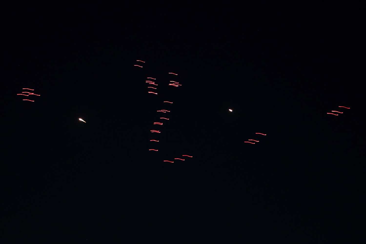 Tracer rounds and defense flares in the night sky over Tehran as Iran's air defense systems respond to incoming drones and missiles launched by Israel on June 14, 2025. Photo: Fatemeh Bahrami/Anadolu via Getty Images