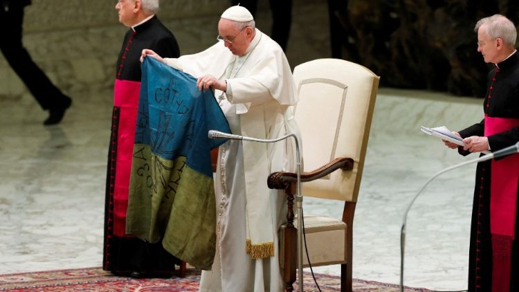 Pope Francis with a flag from Bucha. Vatican News