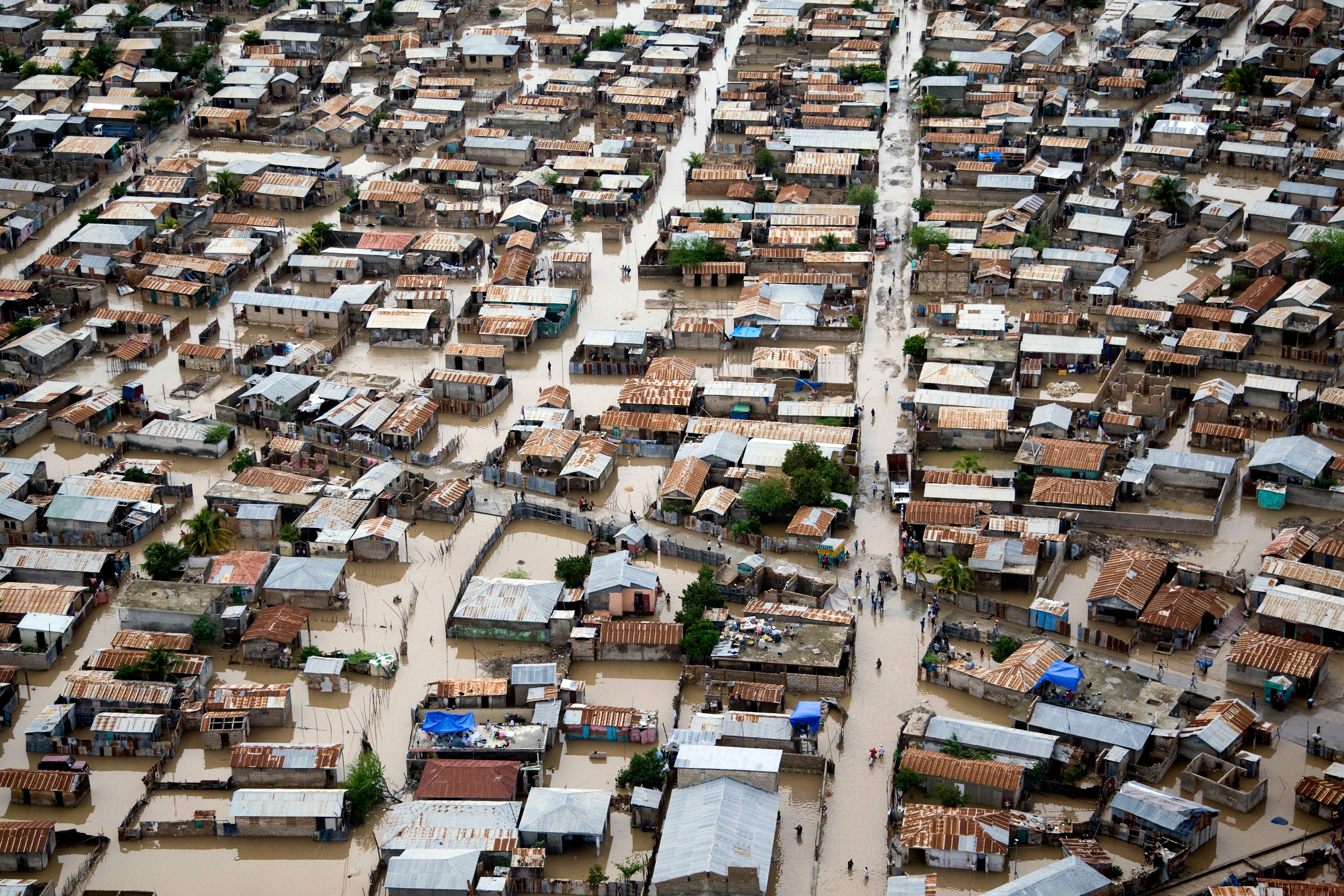 Flooding in Gonaïves, Haiti after Hurricane Tomas in 2010. Informal, densely populated urban areas like this are among those most vulnerable to future climate change. PHOTO: UN/Marco Dormino CC-BY-NC-ND.