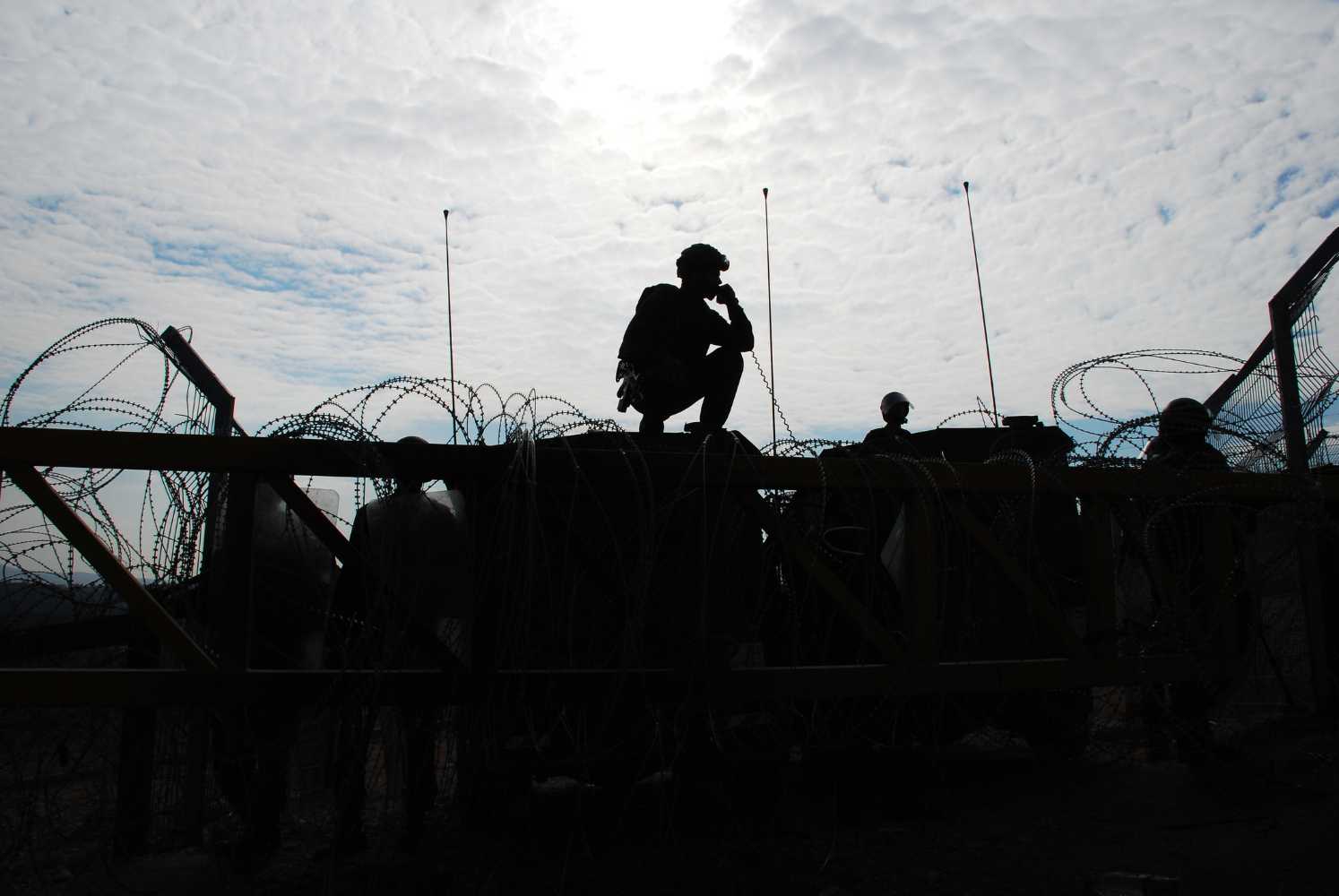 Israeli soldiers guarding a barrier. Photo: Getty Images
