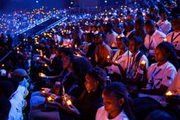 Young Rwandans take part in a candle lit vigil on the first of 100 days of remembrance as Rwanda commemorates the 30th anniversary of the Tutsi genocide on April 7, 2024 in Kigali, Rwanda. Photo: Luke Dray / Getty Images