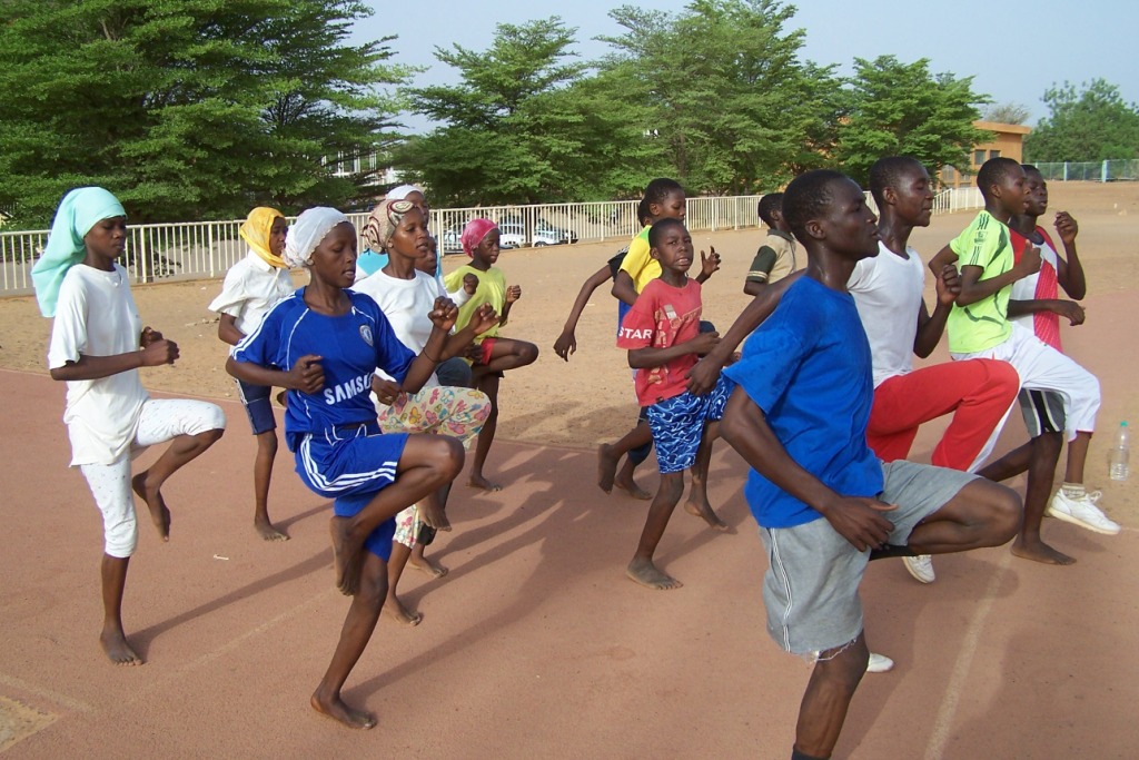 Girls and boys train and play sports together in Niger. Association Sportive Les Volcans via Flickr CC