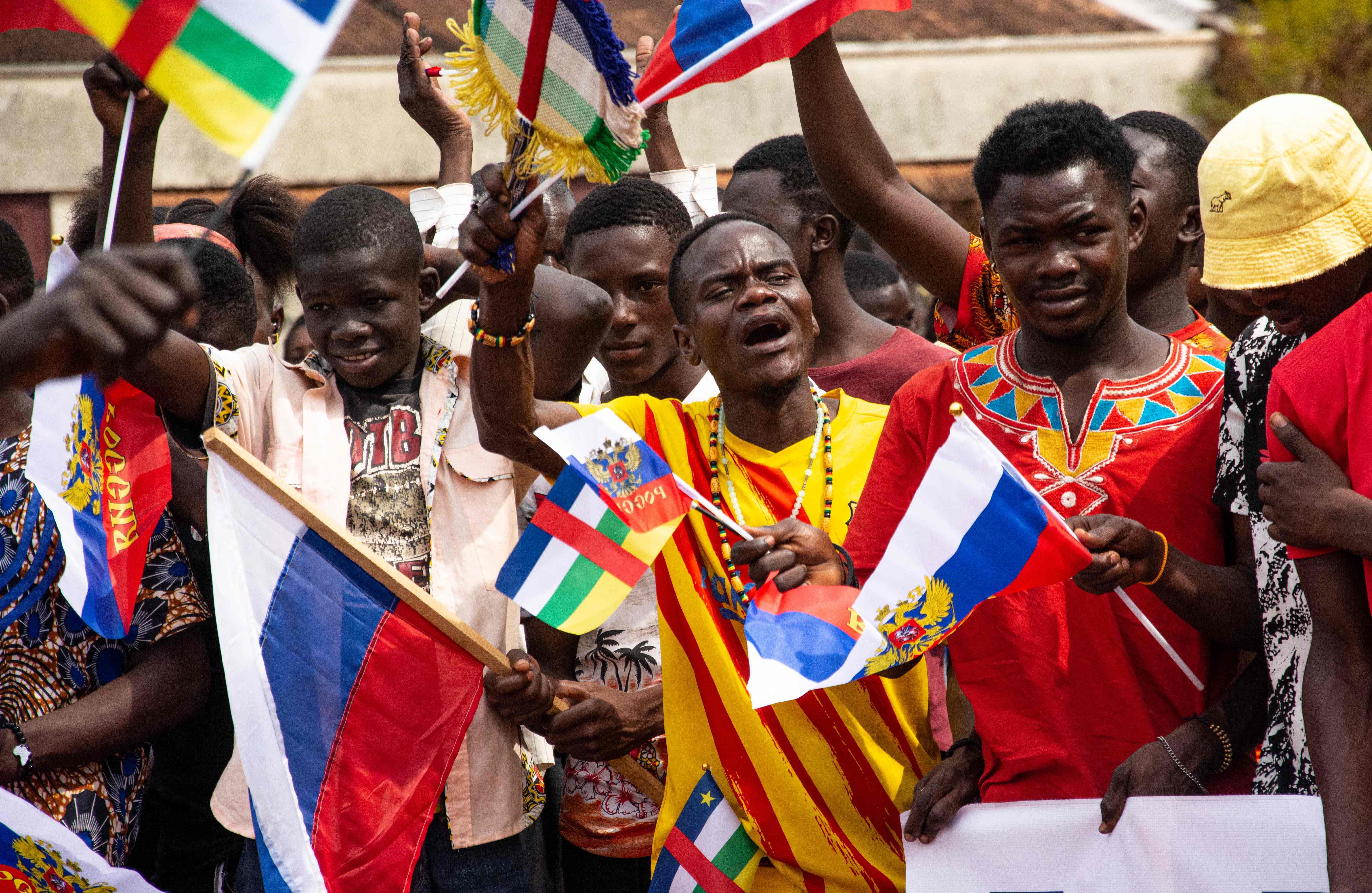 Russian and Central African Republic flags are waived by demonstrators gathered in Bangui on March 5, 2022 during a rally in support of Russia. Carol VALADE / AFP